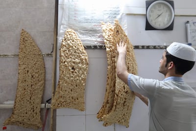 A baker prepares sangak bread at a bakery in Tehran. AFP