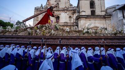 Worshipers carry a religious float with an image of Jesus Christ during a Good Friday procession in Antigua, Guatemala. AP Photo