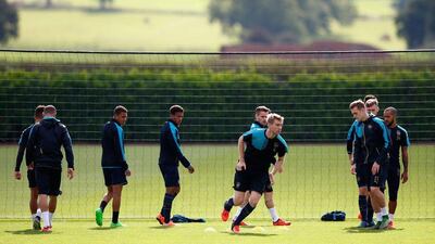 er Mertesacker of Arsenal warms up during traing on Monday in London. Shaun Botterill / Getty Images