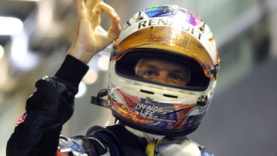Sebastian Vettel celebrates winning in Singapore.