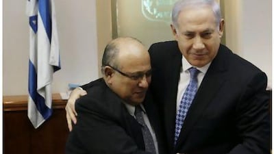 Israeli prime minister Benjamin Netanyahu, right, embracing the departing director of the spy agency Mossad, Meir Dagan, after thanking him in Jerusalem in January this year. Mr Netanyahu is less of a fan of Mr Dagan now, after the ex-spy called him 'reckless' and 'irresponsible.