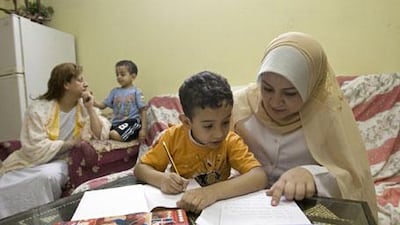 Huda Ismail moved to Dubai with her children to earn more money. Her husband, who has lost one eye and has a detached retina in the other, had to remain in Egypt.