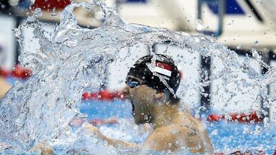 Joseph Schooling of Singapore celebrates after winning in the men's 100m butterfly at the Rio 2016 Olympics on Friday. Patrick B Kramer / EPA / August 12, 2016
