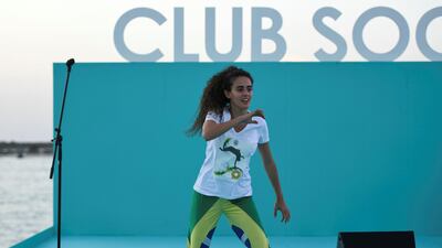Capoeira Dubai Cirilo, a Brazilian martial art group performs for the audience at Club Social festival on Yas Beach. Khushnum Bhandari for The National