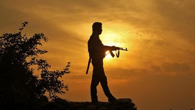 A policeman stands guard at his post near Jammu, Kashmir. Mukesh Gupta / Reuters