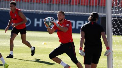 Atletico goalkeeper Jan Oblak makes a catch.