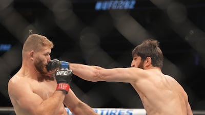 Magomed Ankalaev lands a jab on Jan Blachowicz during UFC 282 at T-Mobile Arena. USA Today