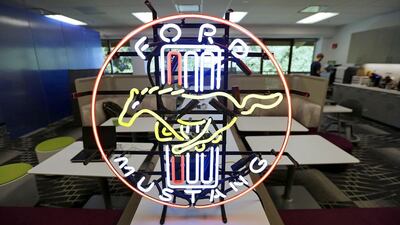 Above, a neon sign inside the Ford research laboratory at Palo Alto. Eric Risberg / AP Photo