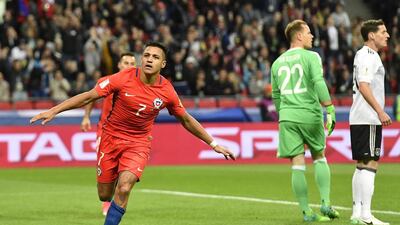 Chile's Alexis Sanchez celebrates after scoring the opening goal during the Confederations Cup group match against Germany. Martin Meissner / AP Photo