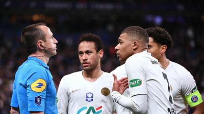 PSG forward Kylian Mbappe reacts as he receives a red card from referee Rudy Buquet. Martin Bureau / AFP