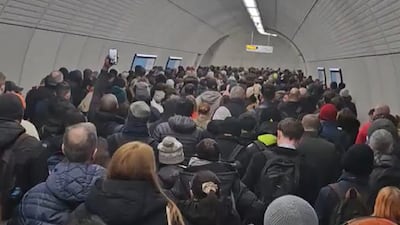 Commuters at a crowded Tottenham Court Road underground station. PA