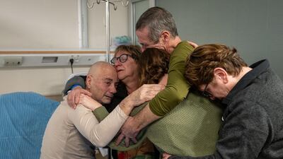 Israeli-Argentinian hostage Louis Har (L) being reunited with his family at the Tel Hashomer Hospital in Ramat Gan, on the outskirts of Tel Aviv. AFP