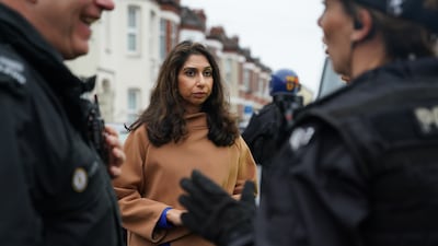 Ms Braverman attends a county lines raid with officers from West Midlands Police in Coventry in October. PA