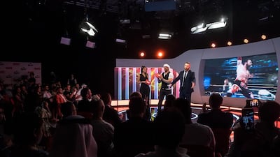 From left, Nathalie Mamo and Moen Al Bastaki, who will present WWE Wal300ha, with Syrian-Canadian wrestler Sami Zayn during the show’s launch in Dubai. Courtesy OSN