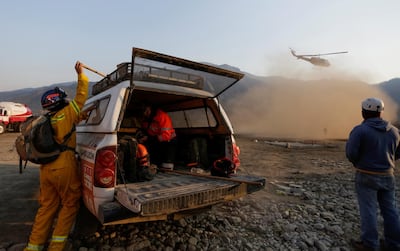 Members of civil protection prepare to work to extinguish a wildfire at the Sierra de Santiago, on the outskirts of Monterrey, Mexico March 20. Reuters