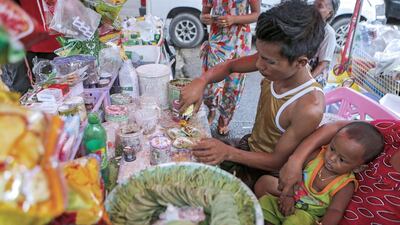 A street vendor mixed tobacco liquid onto betel quids. Officials from Myanmar’s Ministry of Health and Sports told state media that the country has plans to launch campaigns in metropolitan cities and big towns to remove betel stands from public places and tourist attraction sites as an initial step to cut down on the use of betel. Lynn Bo Bo / EPA