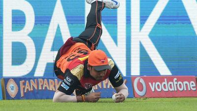 Sunrisers Hyderabad fielder Karn Sharma dives to stop a boundary during the 2016 Indian Premier League (IPL) Twenty20 cricket match between Kolkata Knight Riders and Sunrisers Hyderabad at the Eden Gardens Cricket Stadium in Kolkata on May 22, 2016. Dibyangshu Sarkar / AFP