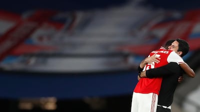 Arsenal manager Mikel Arteta celebrates with Ainsley Maitland-Niles. EPA