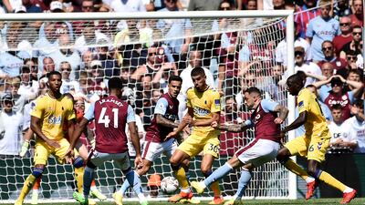 Aston Villa's Danny Ings scores the opening goal. AP