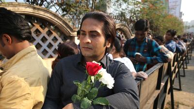 A mourner waits in queue to pay his respects. Rafiq Maqbool / AP Photo