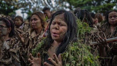 Devotees covered in mud and dried banana leaves take part in the Taong Putik ("mud people") Festival in the village of Bibiclat in Aliaga town, Nueva Ecija province, Philippines. Each year, the residents of Bibiclat village in Aliaga town celebrate the Feast of Saint John by covering themselves in mud, dried banana leaves, vines, and twigs as part of a little-known Catholic festival. Getty Images