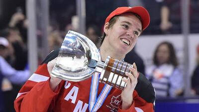 Canada's Connor McDavid skates with the trophy following his team's 5-4 win over Russia in the title game at the hockey World Junior Championship in Toronto. The Edmonton Oilers have won the NHL draft lottery and the right to select McDavid first overall. (Frank Gunn/The Canadian Press via AP