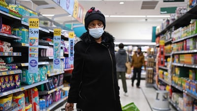 A shopper at a Morrisons supermarket in London. EPA