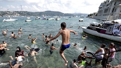 Syrian refugees enjoy a sunny day in Bosphorus in Istanbul, Turkey. More than 40 per cent of Syria’s pre-war population of 22.4 million has been displaced by the conflict, with 2.8 million taking refuge in other countries in the region. Erdem Sahin / EPA