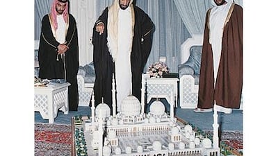 The late Sheikh Zayed inspects the plan of the Sheikh Zayed Mosque with his sons Sheikh Hamdan, left, and Sheikh Sultan.