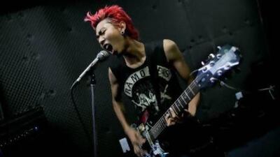 Kyaw Kyaw, lead singer of punk rock band Rebel Riot, rehearses with his group members in a Yangon studio.