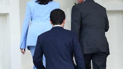 US Vice President Kamala Harris welcomes Jordan's King Abdullah II at her residence at the Naval Observatory in Washington.