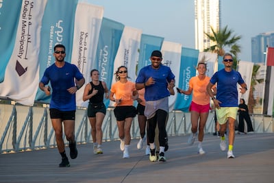 Residents step out on the new running track at the popular beach. Ahmed Ramzan / The National