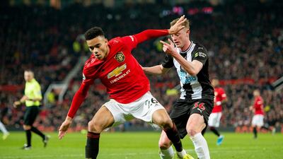 Manchester United's Mason Greenwood vies for the ball with Newcastle's Sean Longstaff at Old Trafford. EPA