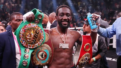 Terrence Crawford celebrates with his championship belts after defeating Errol Spence Jr. Getty Images