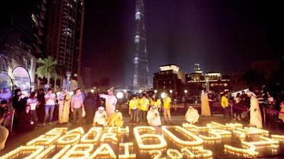 ??Participants around candles and lanterns during the Earth Hour 2013 Earth Hour Walk celebration at the Burj Plaza. Jaime Puebla / The National