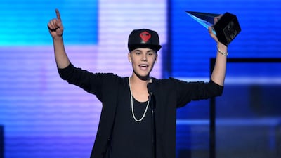 Justin Bieber accepts the award for favorite album - pop/rock for Believe at the 40th Anniversary American Music Awards, in Los Angeles, on November 18, 2012. John Shearer / AP