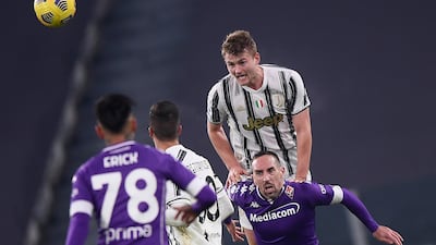 Juventus' Matthijs de Ligt leaps to win a header against Fiorentina. AP