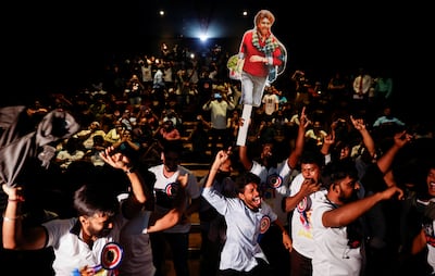 Fans of Tamil film star Rajinikanth celebrate the return of the actor on the big screen in Mumbai. Reuters