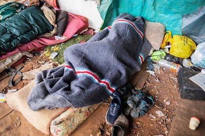 A homeless man sleeps next to a railway line on day 8 of the 21-day national lockdown following President Cyril Ramaphosa's declaration of a national disaster as a result of coronavirus, in Pretoria, South Africa, on April 3, 2020. EPA