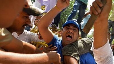 Indian supporters of the Delhi Pradesh Youth Congress shout slogans against Delhi Chief Minister Arvind Kejriwal as they clash with police outside his house during a protest against the suicide of a farmer at a rally organised by Kejriwal's Aam Admi Party in New Delhi on April 23. AFP Photo