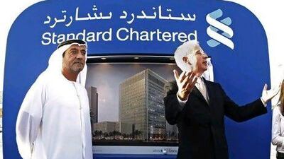 Sheikh Ahmed bin Saeed Al Maktoum, left, the chairman of Emirates Group, and Peter Sands, the group chief executive of Standard Chartered, at the ground breaking ceremony for the bank's new headquarters in Dubai.