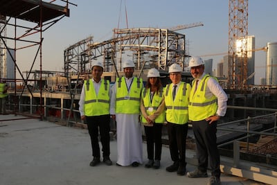 The Al Farwaniya Property Developers team outside the semi-constructed snow park structure within Reem Mall