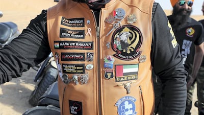 The bikers wear jackets sporting all sorts of badges and motivational sayings embroidered on. Pawan Singh / The National