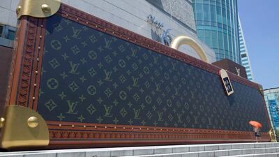 A giant mockup of a suitcase outside a Louis Vuitton store in Shanghai. LVMH has reported a rise in sales in China as consumers spend more on luxury goods. EPA