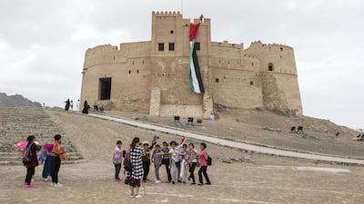 Chinese tourists at Fujairah Fort. Many such historic monuments make the emirate a popular tourist destination. Antonie Robertson / The National