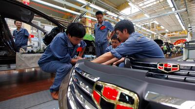 Employees check plastic bumpers along a Geely Automobile Corporation assembly line in Cixi, Zhejiang province. The auto sector is a lucrative market for plastics and petrochemicals makers Carlos Barria/Reuters