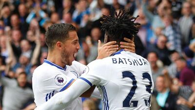 Michy Batshuayi celebrates his equalising goal with Eden Hazard. Ian Kington / AFP