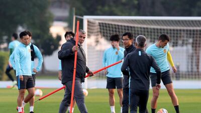 Cosmin Olaroiu sets up training at Dubai Police Academy Stadium.