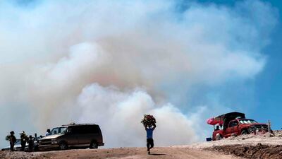 Smoke billows from bush fires in eastern Tijuana, Baja California state, Mexico. AFP