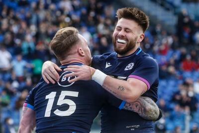 Scotland's Stuart Hogg (L) celebrates with Ali Price after scoring a try in Rome. EPA